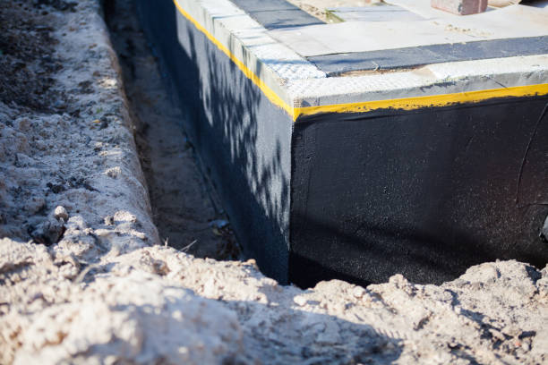 Professional Waterproofing technician working in Frederick, MD